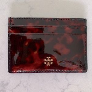 Tory Burch Tortoise shell patent leather card holder.